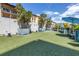 Relaxing green space with palm trees and seating areas for residents of the condo community to enjoy the outdoors at 199 Dali Blvd # 902, St Petersburg, FL 33701