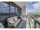 A lovely balcony with comfortable seating that offers scenic views of the city at 199 Dali Blvd # 902, St Petersburg, FL 33701