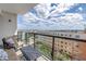 Relax on this condo balcony with outdoor seating and a beautiful view of the city at 199 Dali Blvd # 902, St Petersburg, FL 33701