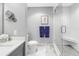 Elegant bathroom showcasing a glass shower with a built-in bench and white subway tile at 199 Dali Blvd # 902, St Petersburg, FL 33701