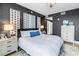This bedroom features an accent wall and a doorway to the bathroom at 199 Dali Blvd # 902, St Petersburg, FL 33701