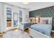 Bright, airy bedroom with two twin beds, large windows, and floral wallpaper at 199 Dali Blvd # 902, St Petersburg, FL 33701