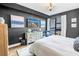 Modern bedroom features sleek furniture, city view, and artwork at 199 Dali Blvd # 902, St Petersburg, FL 33701