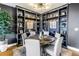 Elegant dining room with a round table and custom built-in shelving at 199 Dali Blvd # 902, St Petersburg, FL 33701