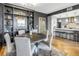 Dining room with hardwood floors, modern lighting, and custom built-in shelving at 199 Dali Blvd # 902, St Petersburg, FL 33701