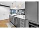 Beautiful kitchen with modern appliances, quartz countertops, and a view into the elegant living room at 199 Dali Blvd # 902, St Petersburg, FL 33701