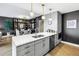 Spacious open-concept kitchen featuring modern cabinetry, quartz countertops, and stainless steel appliances at 199 Dali Blvd # 902, St Petersburg, FL 33701