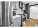 Well-equipped kitchen featuring stainless steel appliances, ample counter space, and stylish gray cabinetry at 199 Dali Blvd # 902, St Petersburg, FL 33701