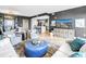 Elegant open-concept living room with modern decor, sleek flooring, and a seamless flow to the dining area at 199 Dali Blvd # 902, St Petersburg, FL 33701