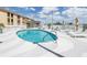 Outdoor pool featuring blue water and surrounded by lounge chairs and umbrellas at 199 Dali Blvd # 902, St Petersburg, FL 33701