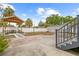 Outdoor space with a gazebo, concrete and brick patios, and stairs leading to the house at 212 N Bradford Ave, Tampa, FL 33609