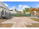 Brick and concrete patio with gazebo, stairs to the house, and a well-maintained yard at 212 N Bradford Ave, Tampa, FL 33609