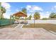 Backyard featuring a gazebo with outdoor seating, brick and concrete patio, and string lights at 212 N Bradford Ave, Tampa, FL 33609
