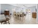 Inviting dining room features a chandelier, a large dining table, and access to the outdoor patio area at 212 N Bradford Ave, Tampa, FL 33609