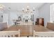 Open concept dining room showing kitchen, center island with barstools and pendant lights at 212 N Bradford Ave, Tampa, FL 33609