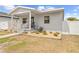 Charming single-story home with white trim, front porch and xeriscaped yard at 212 N Bradford Ave, Tampa, FL 33609