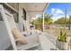 Inviting front porch with rocking chairs and decorative plants, perfect for relaxing outdoors at 212 N Bradford Ave, Tampa, FL 33609