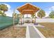 Backyard gazebo with outdoor seating, a concrete base, and string lights for entertaining at 212 N Bradford Ave, Tampa, FL 33609
