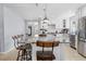 Modern kitchen showcasing a large island with seating, granite countertops, and stainless steel appliances at 212 N Bradford Ave, Tampa, FL 33609