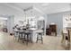 Contemporary kitchen with island seating, pendant lighting, and an open layout connected to the dining area at 212 N Bradford Ave, Tampa, FL 33609