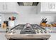 Kitchen featuring stainless steel range with white cabinets and gray countertops at 212 N Bradford Ave, Tampa, FL 33609