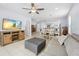 Spacious open-concept living space featuring a cozy living area and dining area leading to the kitchen at 212 N Bradford Ave, Tampa, FL 33609