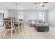 Open-concept living area with dining space, comfortable seating, and a view into the kitchen at 212 N Bradford Ave, Tampa, FL 33609