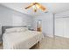 Light-filled main bedroom with a ceiling fan and doorway to ensuite bath at 212 N Bradford Ave, Tampa, FL 33609
