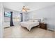 Spacious main bedroom with tile floors, ceiling fan, and natural light at 212 N Bradford Ave, Tampa, FL 33609