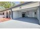 Spacious garage with laundry area, sink, utility, and additional storage space at 2156 Greenbriar Blvd, Clearwater, FL 33763