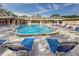 Community pool featuring comfortable lounge chairs for relaxation and recreation at 2156 Greenbriar Blvd, Clearwater, FL 33763