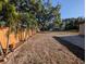 Large backyard featuring a wood fence with palm trees for a touch of nature at 2904 W Marlin Ave, Tampa, FL 33611