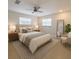 Bedroom with a ceiling fan, a neutral color scheme, and a queen sized bed at 2904 W Marlin Ave, Tampa, FL 33611