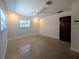 Bright bedroom with two windows and a ceiling fan, perfect for relaxation at 2904 W Marlin Ave, Tampa, FL 33611