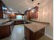 Spacious kitchen features granite countertops, stainless steel appliances, and wood cabinets at 2904 W Marlin Ave, Tampa, FL 33611