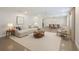 Bright, open-concept living and dining area with contemporary furnishings and neutral color palette at 2904 W Marlin Ave, Tampa, FL 33611