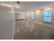 Spacious living room with recessed lighting, ceiling fan and polished concrete floors at 2904 W Marlin Ave, Tampa, FL 33611