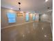 Bright and spacious living area features smooth floors, large windows, ceiling fan and modern light fixture at 2904 W Marlin Ave, Tampa, FL 33611