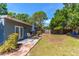 The backyard boasts a patio with seating and a table, perfect for enjoying outdoor meals and relaxation at 3005 W Helen Ave, Tampa, FL 33611