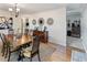 Dining room features a wooden table, hardwood floors, and decorative mirrors on the wall at 3005 W Helen Ave, Tampa, FL 33611