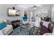 Cozy living room featuring comfortable seating, modern decor, and easy access to the backyard patio at 3005 W Helen Ave, Tampa, FL 33611