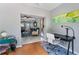 Open concept living space showcasing the sitting room, office and living area at 3005 W Helen Ave, Tampa, FL 33611