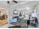 Open-concept living room with a ceiling fan, recessed lighting, comfortable seating, and bright natural light at 3005 W Helen Ave, Tampa, FL 33611