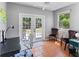 Bright office with a desk, large windows and French doors to the backyard at 3005 W Helen Ave, Tampa, FL 33611