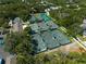 An aerial shot showcases meticulously maintained tennis courts surrounded by mature trees at 3005 W Helen Ave, Tampa, FL 33611
