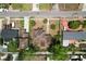 Aerial view shows the rooftops, tree coverage, and street layout of a residential neighborhood at 3016 W Palmetto St, Tampa, FL 33607