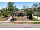 Charming single-story home featuring a quaint front yard with mature trees and a classic design at 3016 W Palmetto St, Tampa, FL 33607