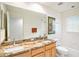 Bathroom featuring dual sinks, granite countertops, and a tub shower combo at 3023 Bent Creek Dr, Valrico, FL 33596
