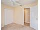 Bedroom with neutral carpet, ceiling fan, and double door closet at 3023 Bent Creek Dr, Valrico, FL 33596