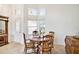 Bright dining room with large windows and classic-style furnishings at 3023 Bent Creek Dr, Valrico, FL 33596